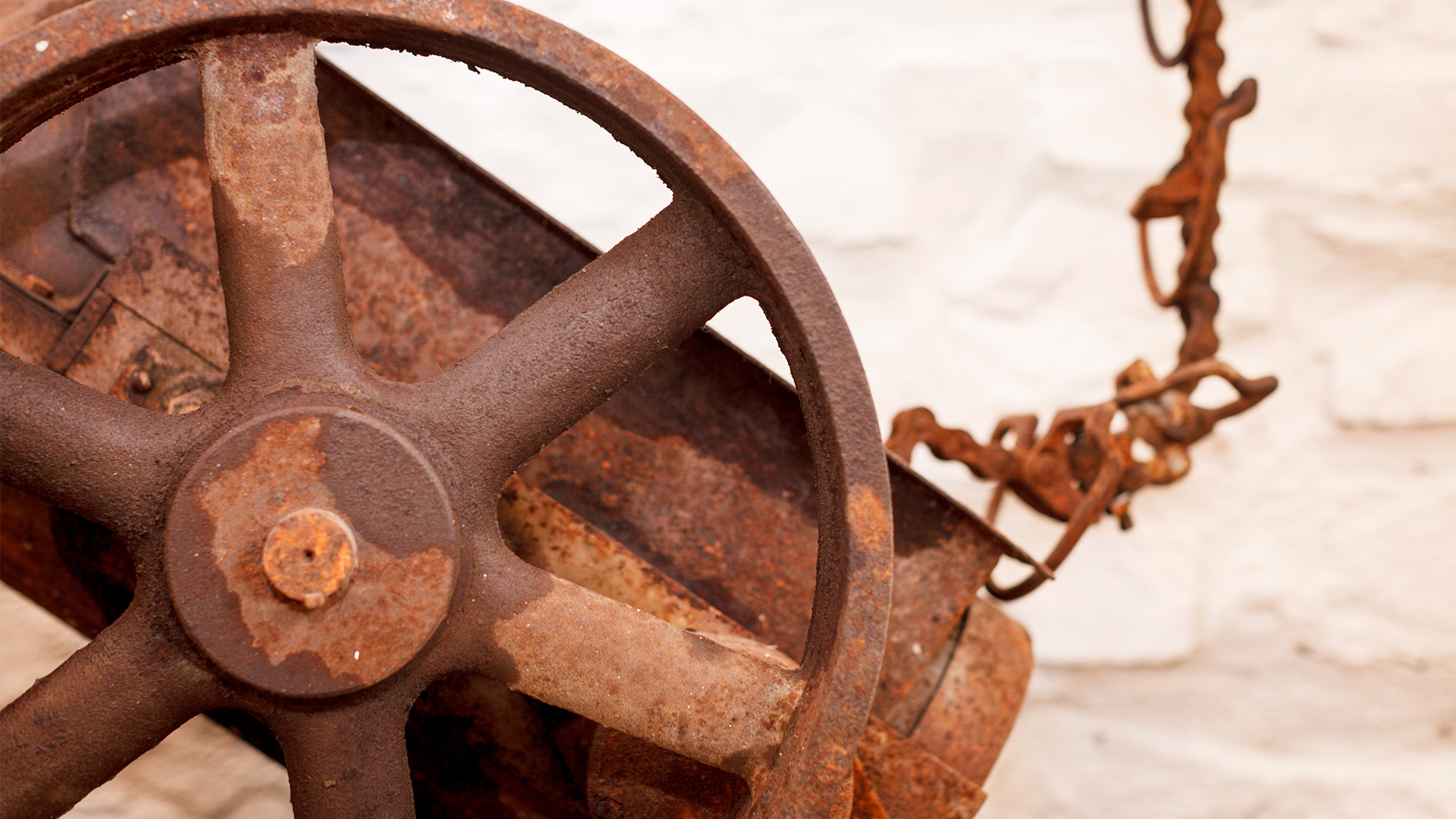 A detail of a rusted piece of machinery displaying the building's historical past