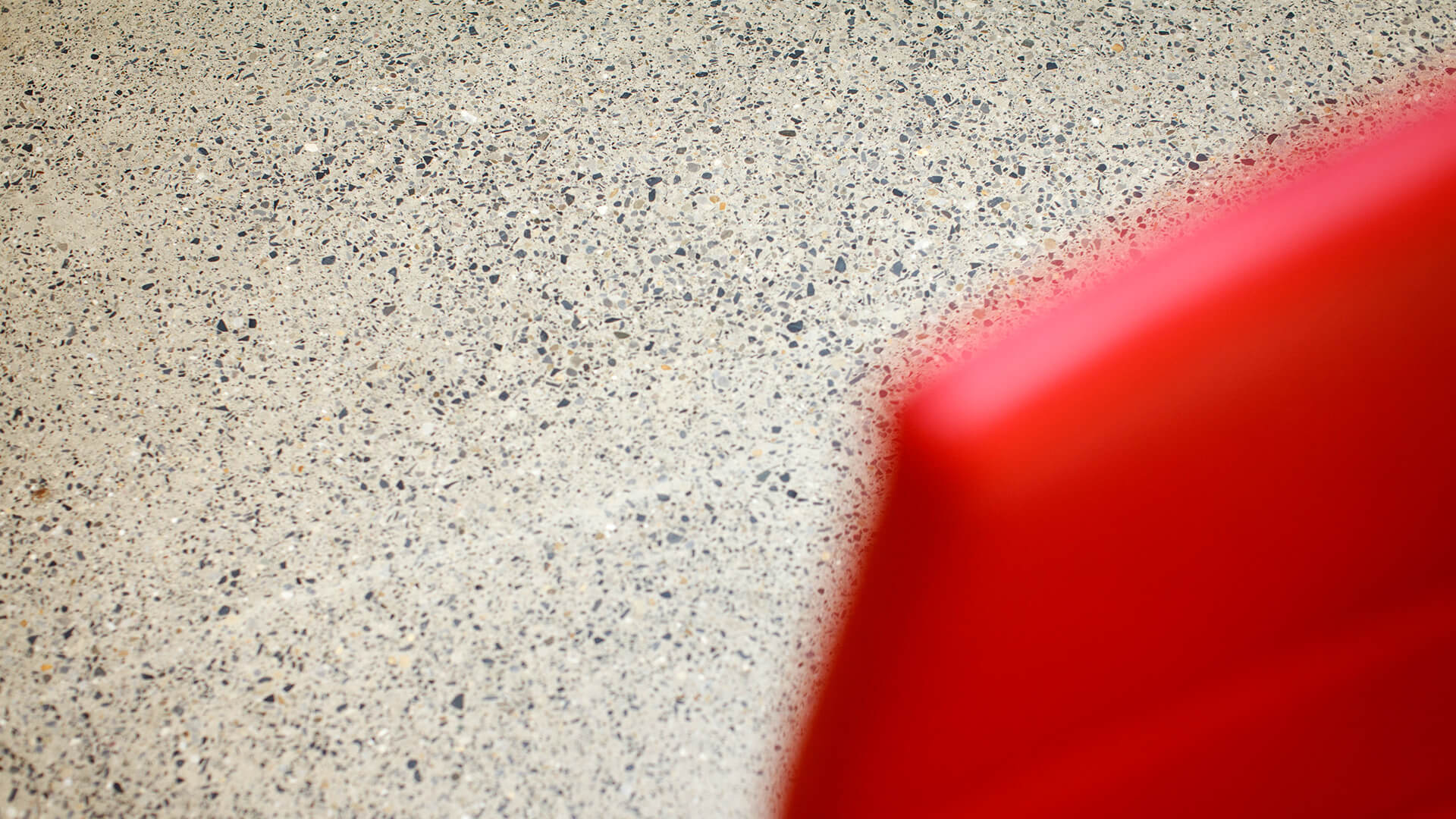 A close-up detail of the polished concrete floors of the Marshalsea Room